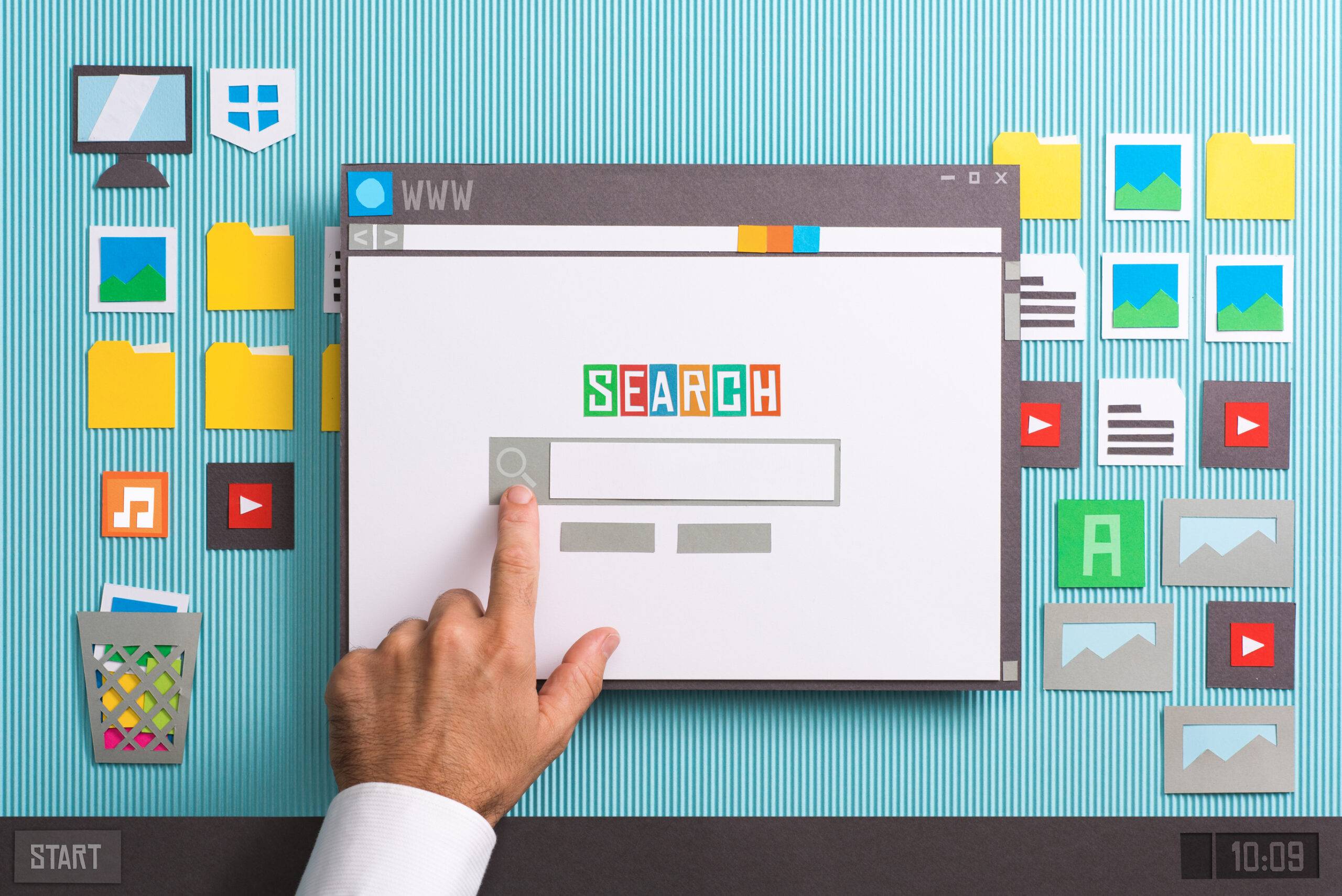 Screen with hand on it getting ready to use search engine
